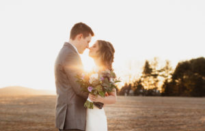 Bride and groom during sunset